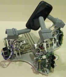 Robot fingers holding an iphone